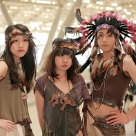 Three Japanese performers dressed up as some weird kind of Indians.