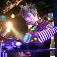 Here he is programming his synth between the songs.