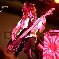 Bassist オガワ (Ogawa)  of マイナス人生オーケストラ (Minus Jinsei Orchestra) during their performance at the Artism Festa event.