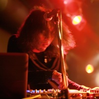 Bass player and programmer Takuya of Zwecklos working on the synthesizer.