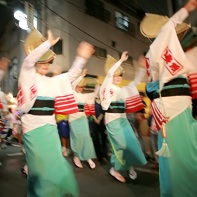 The women dance in their summer kimonos.
