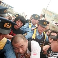 Japanese policemen and anti-nuclear protesters clash in Shinjuku six months after Fukushima.