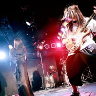 A shot of guitar player Suijo with his bandmates Ryo☆キラリーン and Peat in the background.