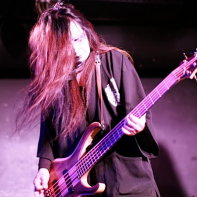 Peace To Pieces' bassist Peat playing at the Club Theatic Show 22 event.