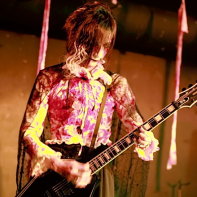 Remnant's guitar player Takmi playing his instrument.