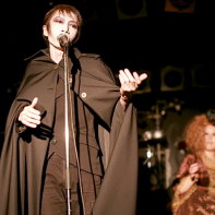 Solomon Grandy's front man Mars Medicis Mephistopher singing with guest dancer Gucci in the background.