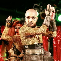 Death Trance Delilah's singers Maiya and Jesus performing together in their matching unitards.