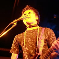 Zodiaque's frontman Naoto singing and playing guitar.