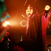 Fans raise their fists for Chihiro during Vanished Empire's performance.