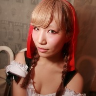 A Japanese girl wearing a naughty Little Red Riding Hood costume.