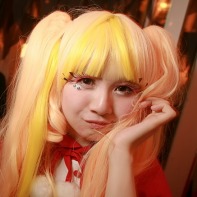 Japanese girl with yellow wig and a cute cosplay.