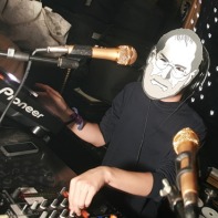 One of the DJs wearing a Steve Jobs mask due to the recent death of the Apple co-founder.