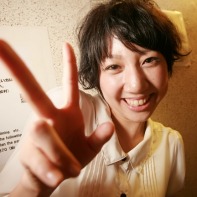 A happy Japanese girl making the v-sign.