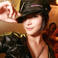 A Japanese lady wearing a PVC police uniform at the Trump Room's pre-Halloween party.