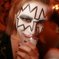 Japanese girl with make-up inspired by Kiss' lead guitarist Ace Frehley.