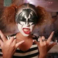 Another girl posing as a Kiss member (this time Gene Simmons).