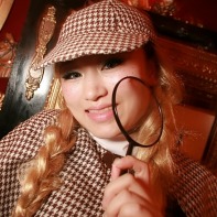 A Japanese girl wearing a fitting Sherlock Holmes costume to the Mysterious Helloween Night.
