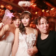 A group of partygoers hastily posing for their picture.