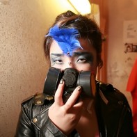 Japanese girl in leather jacket and filter mask.
