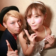 A cool Japanese couple posing at the Trump Room's Halloween party.