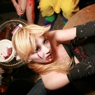 This Japanese girl enjoyed whirling and posing around the club's dance pole.