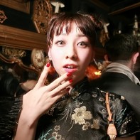A stylish Japanese girl in an Asian dress.