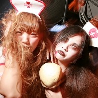 Two girls dressed up as scary nurses.