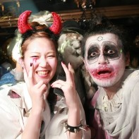 Another Japanese couple posing in their Halloween outfits on the dance floor.