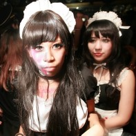 Girl in a scary maid dress (with my flash visible on the left).