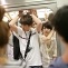 Japanese woman in full passenger car of the penultimate Inokashira train